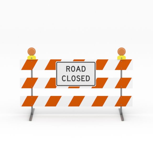 Type III barricade with a Road Closed sign and two warning lights