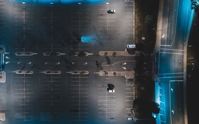 Large parking lot at night, seen from above