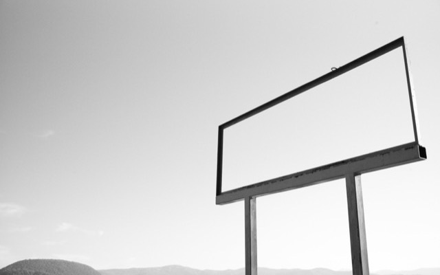 Empty billboard frame against the sky